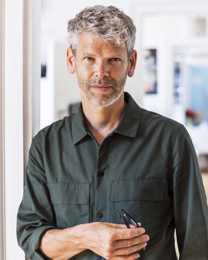 portrait-of-mature-man-with-grey-hair-and-stubble-N2FETGY.jpg